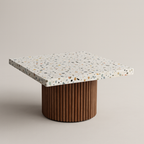 Coffee table with terrazzo top and wooden base on a beige background