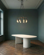Table oval en microciment cirée et pieds demi lune
