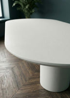Table oval en microciment cirée et pieds demi lune