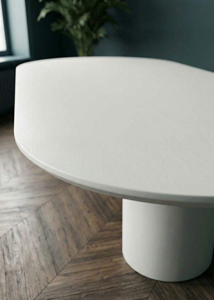Table oval en microciment cirée et pieds demi lune