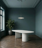 Table ovale en microciment ciré et pieds demi lune